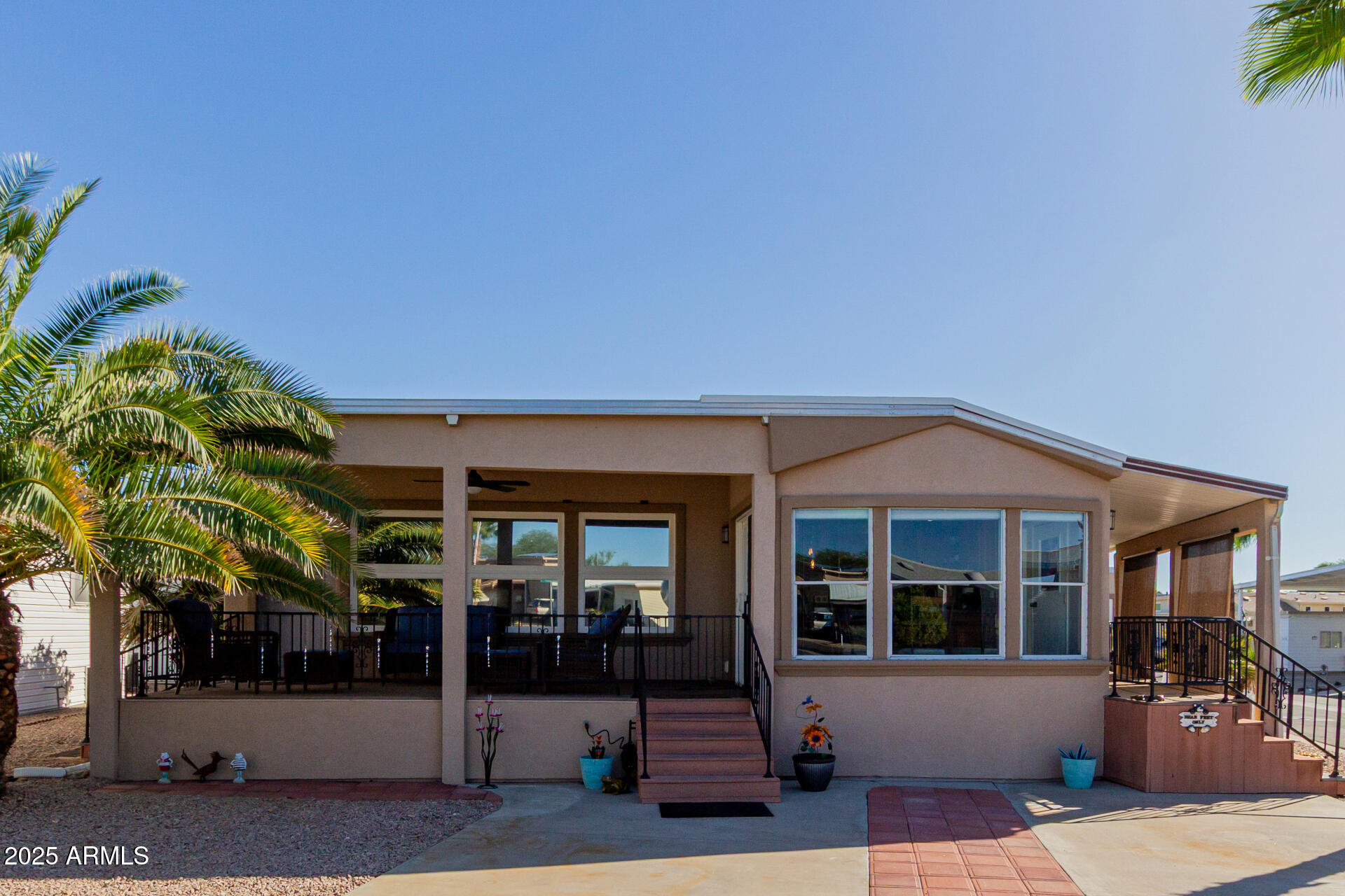 17200 West Bell Road, Unit 1233 Surprise, AZ 85374 - Photo 2 of 41 a front view of a house with a porch
