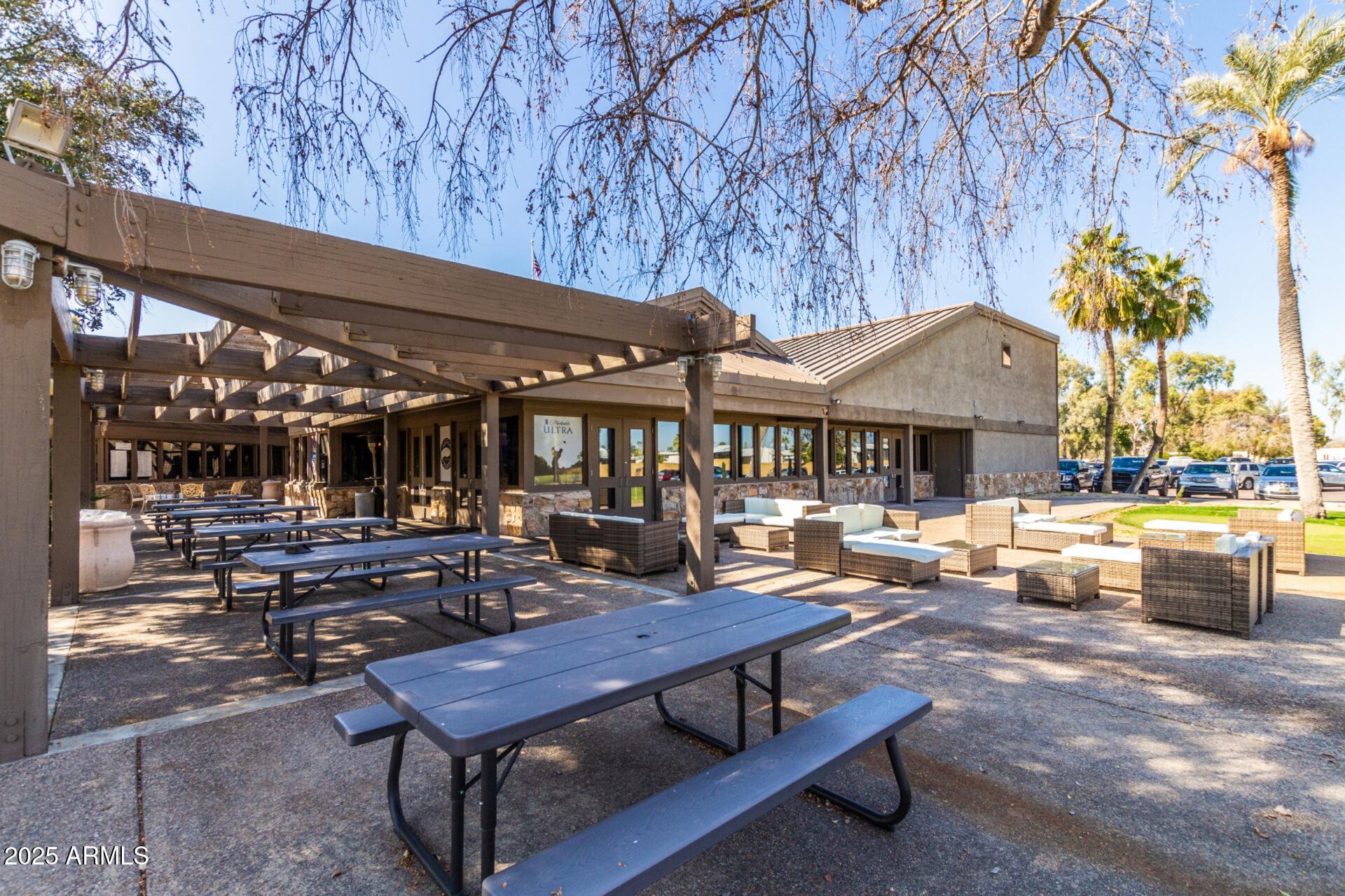 17200 West Bell Road, Unit 1233 Surprise, AZ 85374 - Photo 36 of 41 a view of a patio with chairs and tables