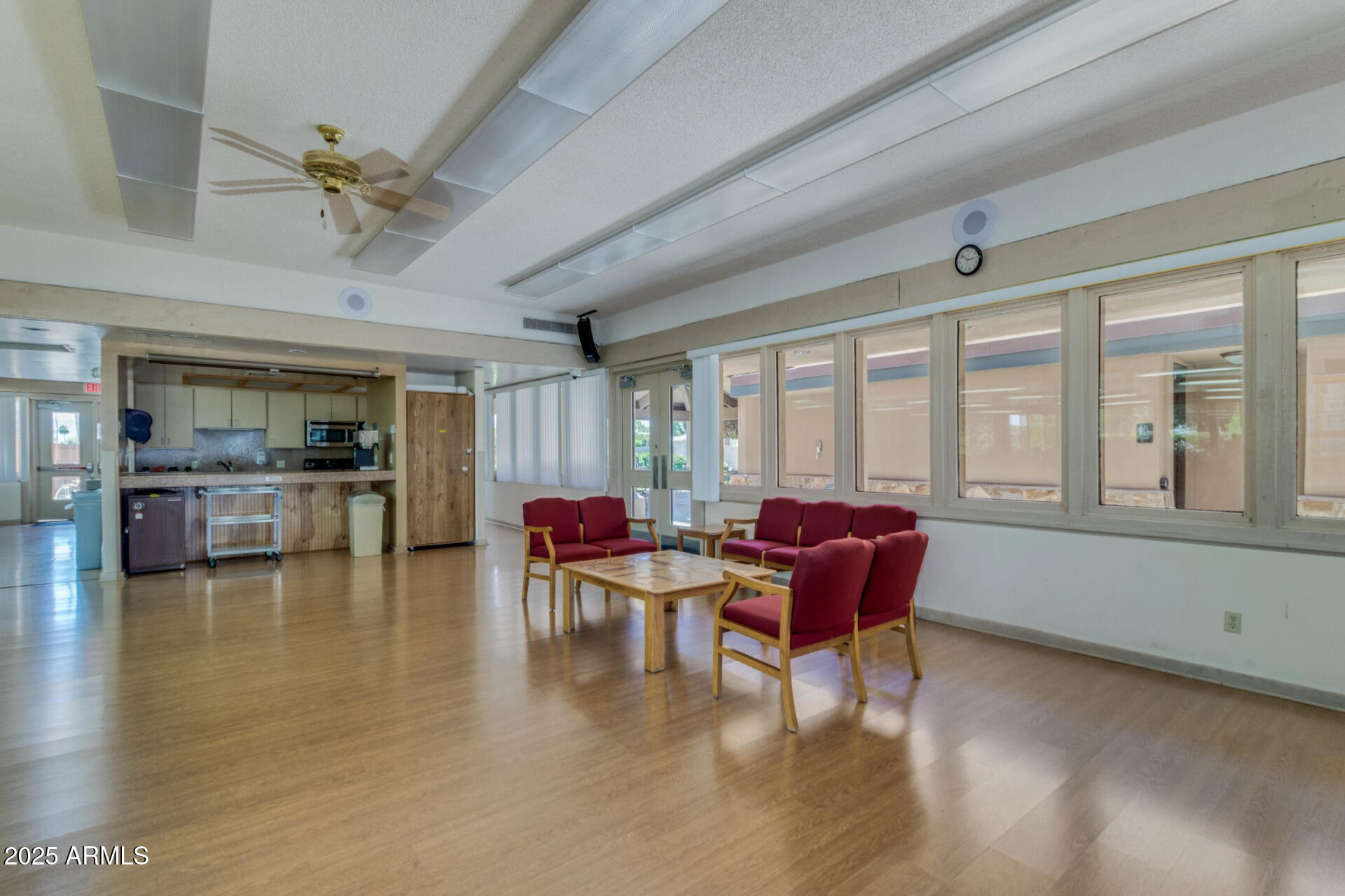 17200 West Bell Road, Unit 1233 Surprise, AZ 85374 - Photo 39 of 41 a view of a dining room with furniture window and wooden floor