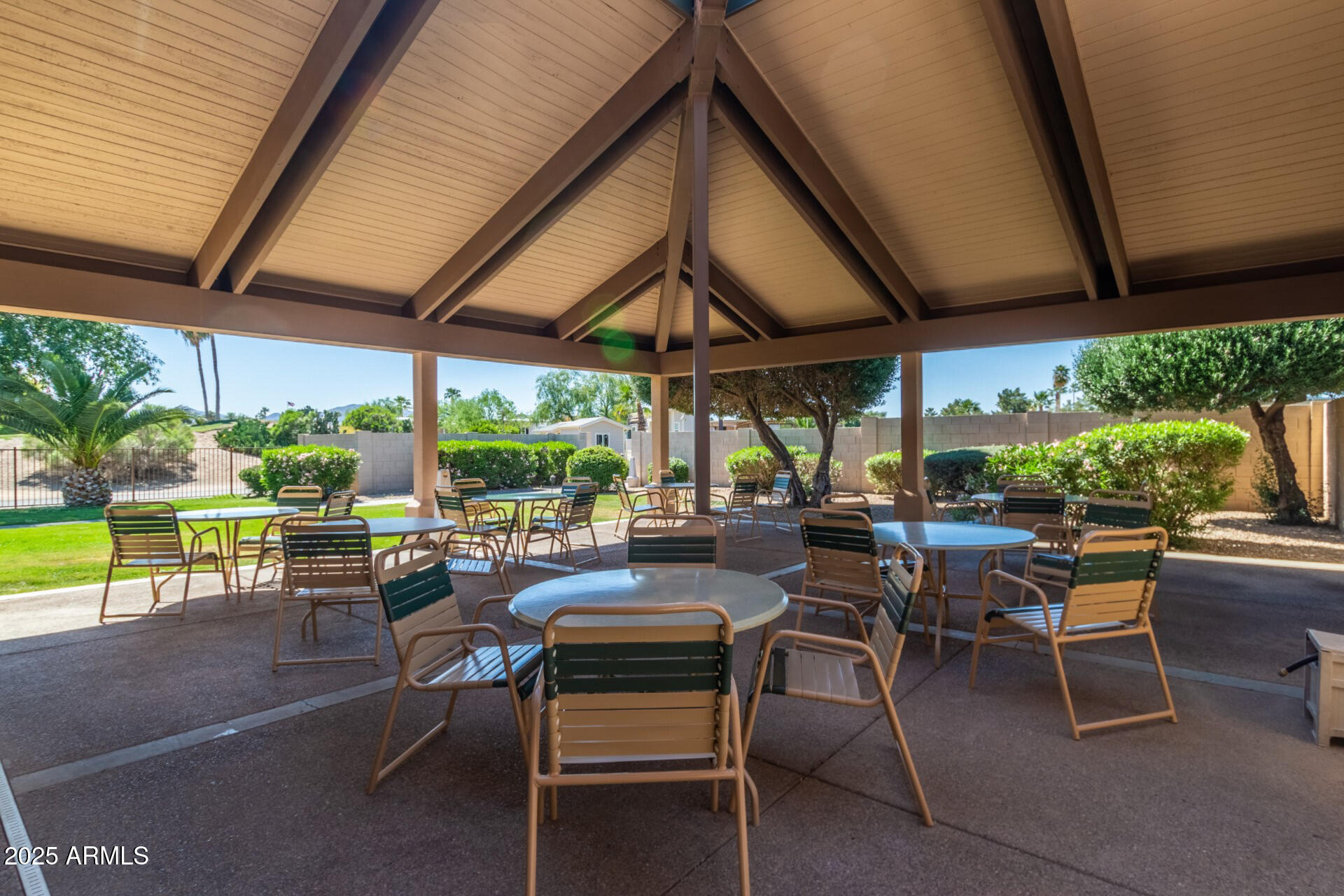 17200 West Bell Road, Unit 1233 Surprise, AZ 85374 - Photo 40 of 41 a view of a patio with a table and chairs under an umbrella