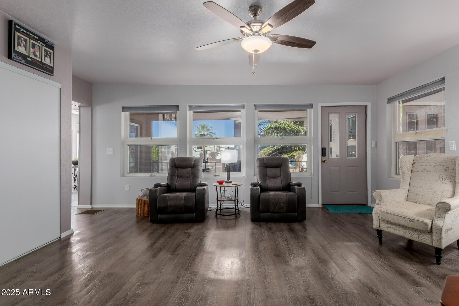 17200 West Bell Road, Unit 1233 Surprise, AZ 85374 - Photo 6 of 41 a living room with furniture and a wooden floor
