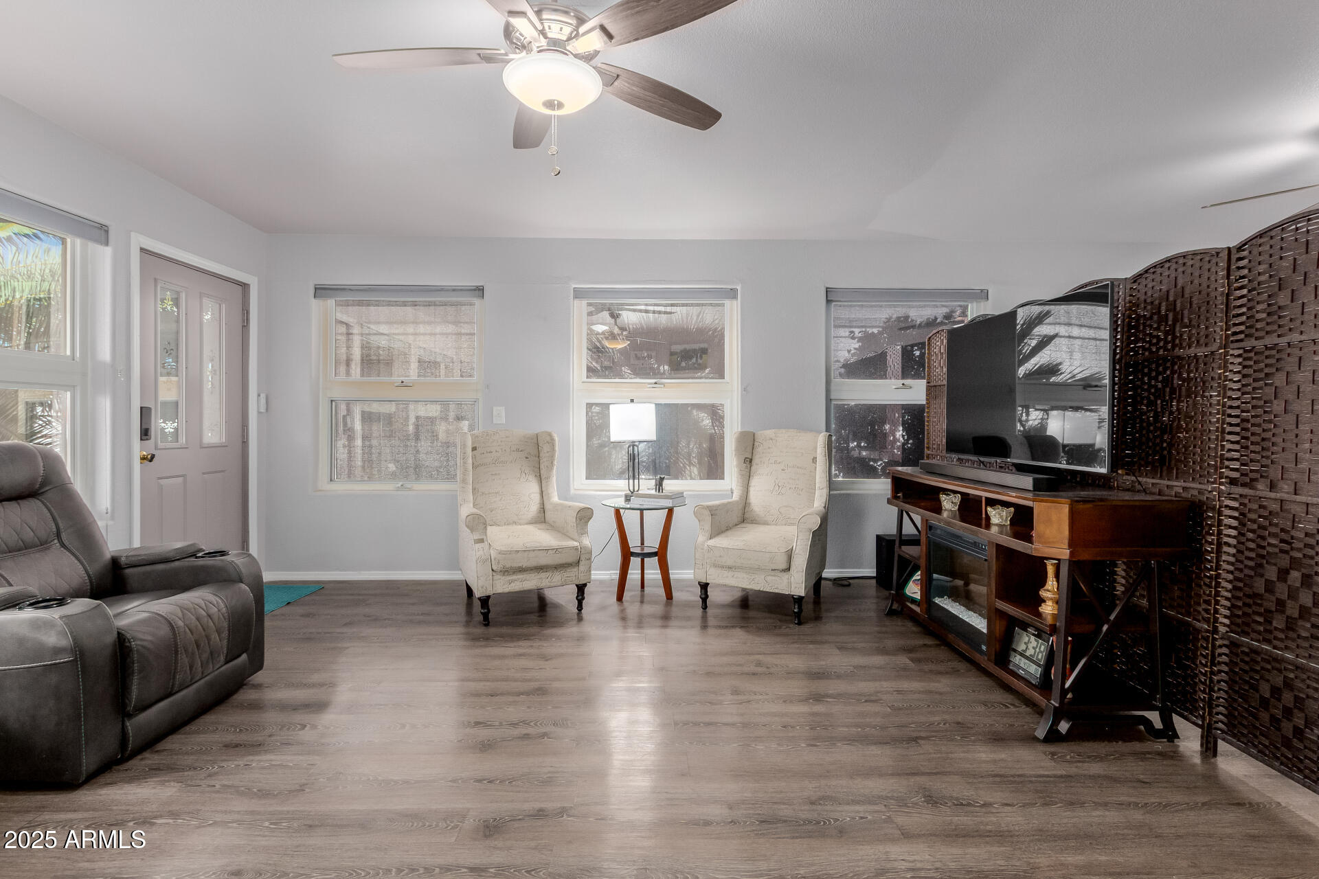 17200 West Bell Road, Unit 1233 Surprise, AZ 85374 - Photo 7 of 41 a living room with furniture and a flat screen tv