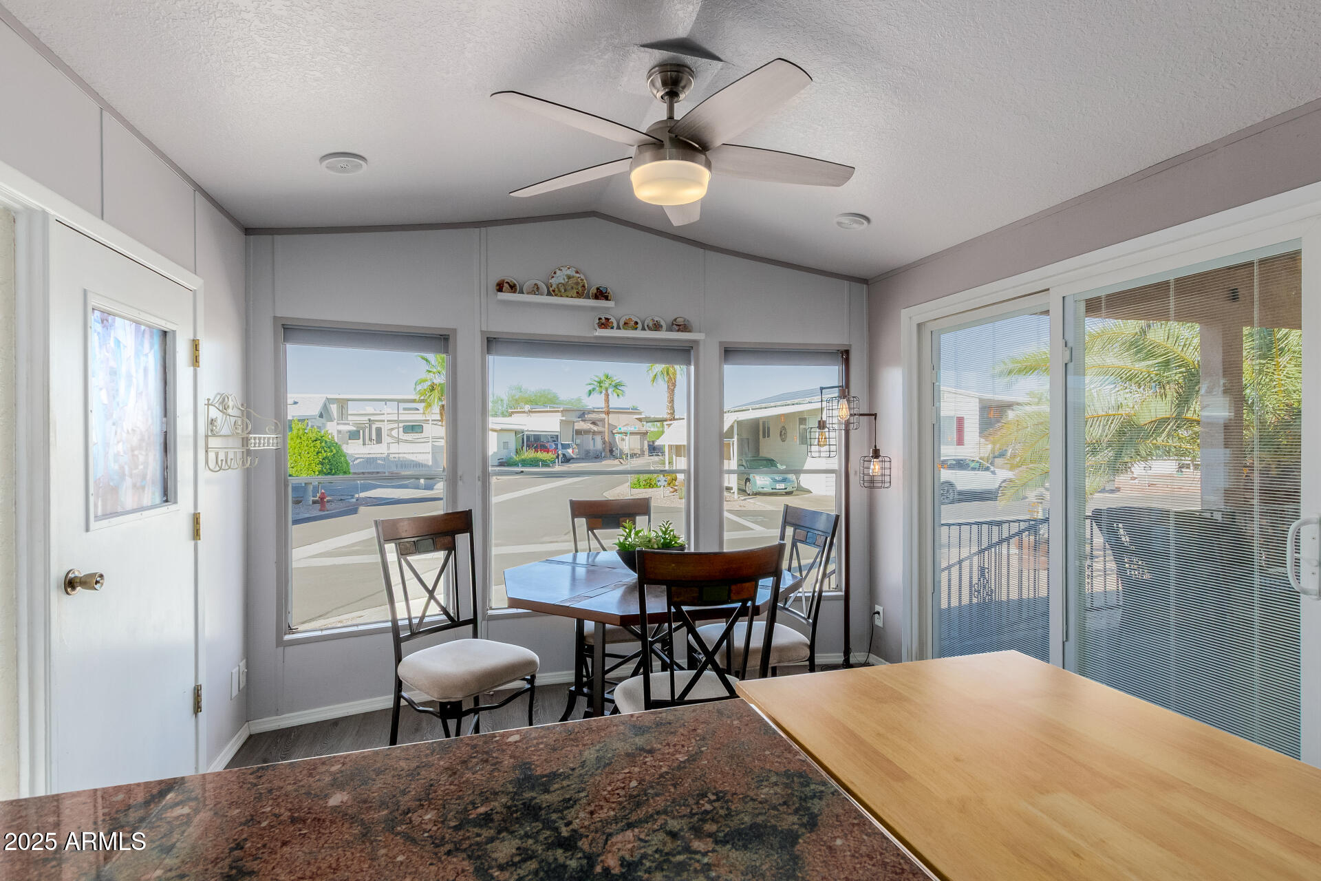 17200 West Bell Road, Unit 1233 Surprise, AZ 85374 - Photo 10 of 41 a view of a dining room with furniture window and outside view