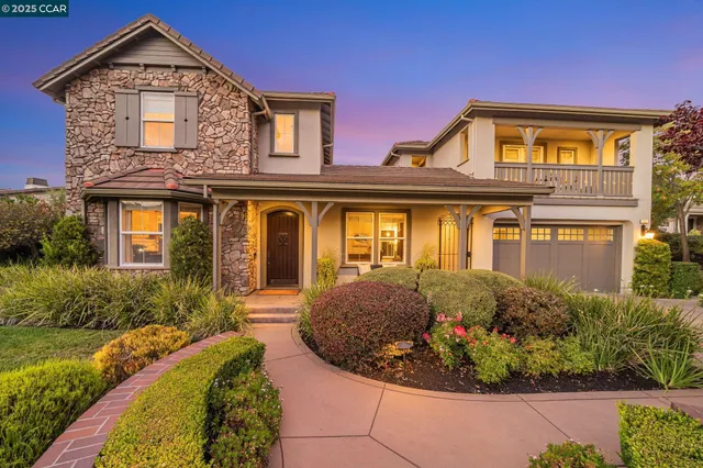 a view of a house with swimming pool and a yard