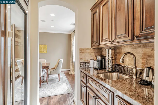 a view of a dining room with furniture wooden floor and chandelier