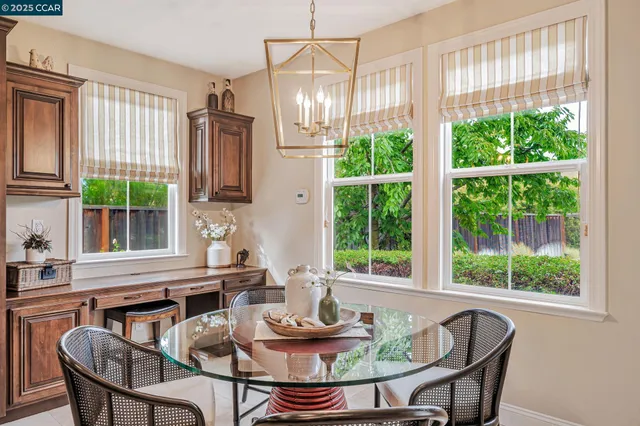 a bedroom with a large bed and a potted plant