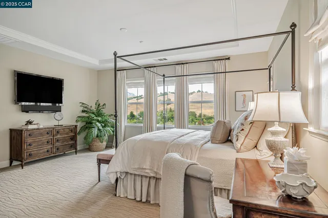 a bathroom with a tub a sink a mirror and a shower