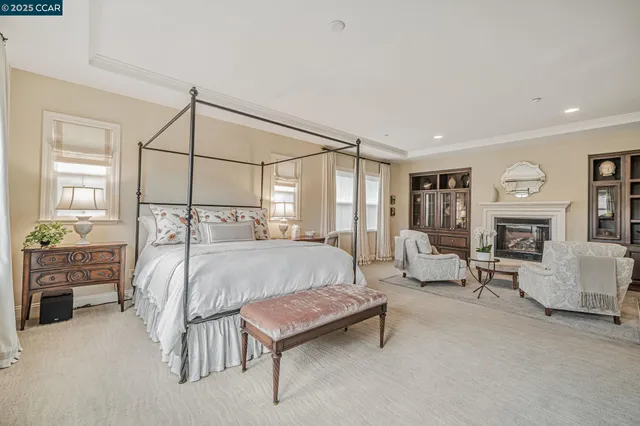 a bath tub sitting in a bathroom next to a window