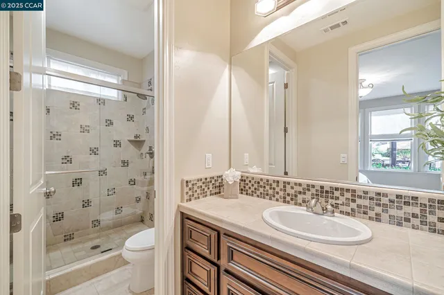 a bedroom with a bed and a lamp