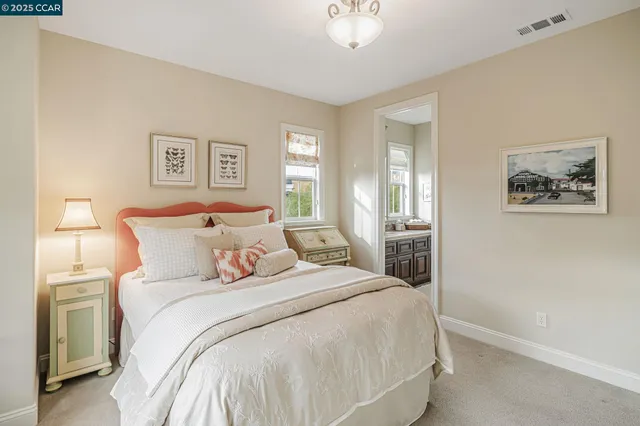 a living room with furniture a dining table and a chandelier