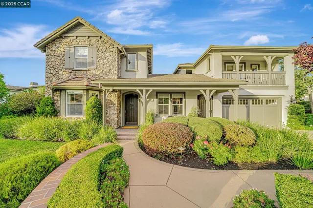 a hallway with a dining table and chairs
