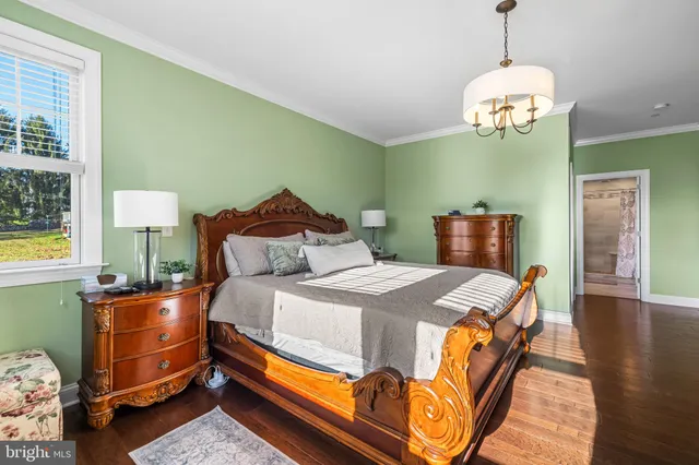 a bedroom with bed and window