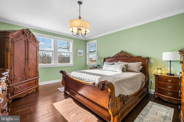 a bed sitting in a room next to a window