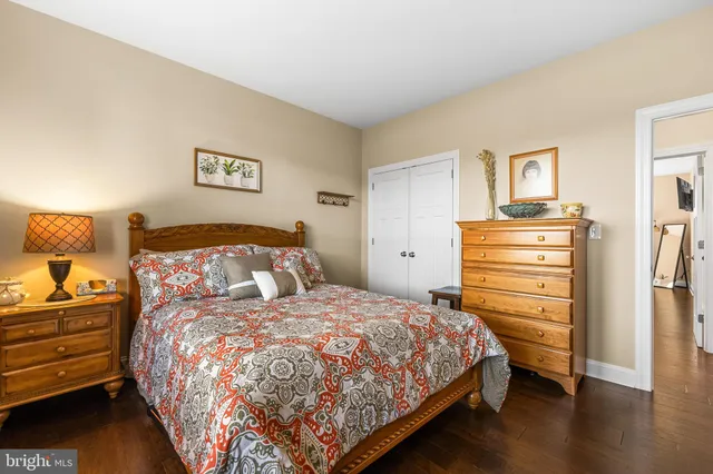 a bedroom with a bed and a closet