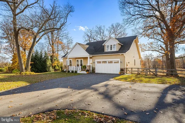 a view of a house with snow on the road