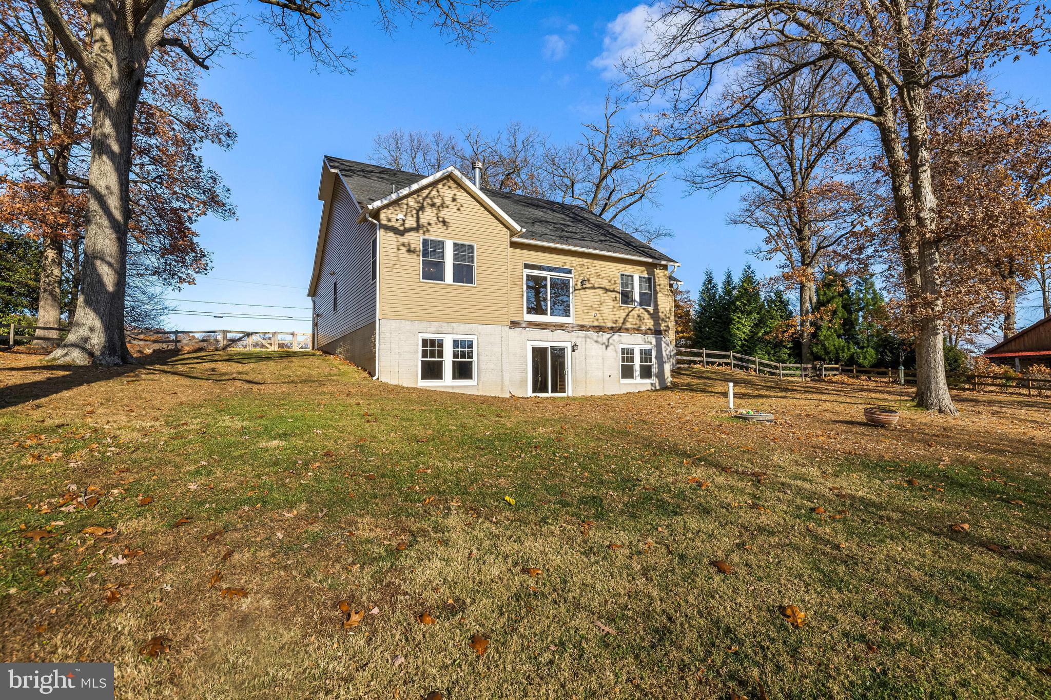 20834 Old York Road Parkton, MD 21120 - Photo 32 of 35 a view of a white house next to a yard with large trees