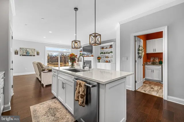 a kitchen with center island and a table