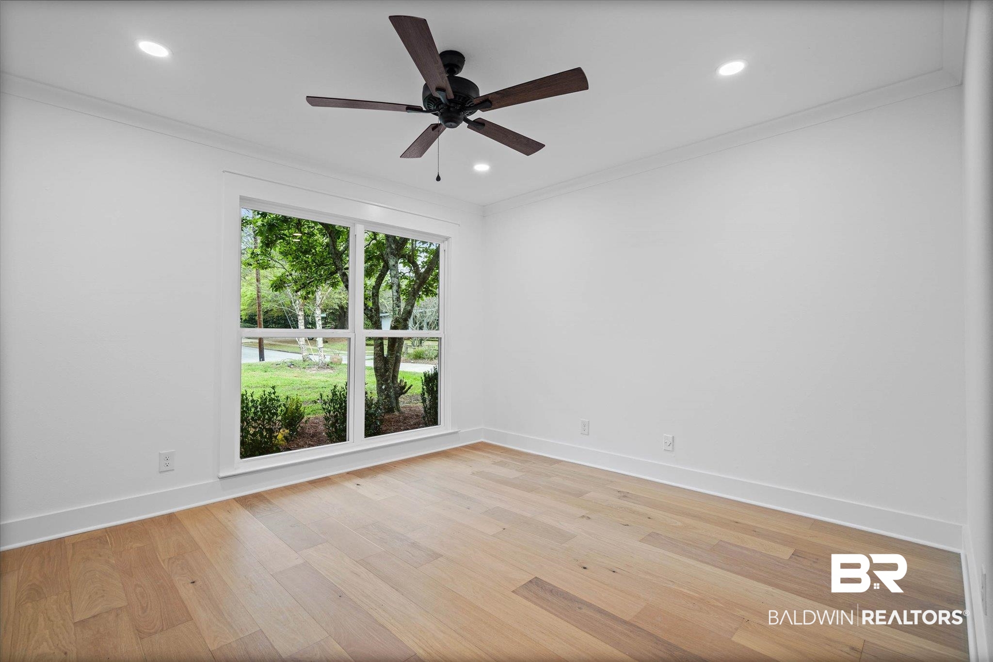 11 Schwaemmle Drive Mobile, AL 36608 - Photo 20 of 32 Empty room with crown molding, ceiling fan, light wood-style floors, and recessed lighting