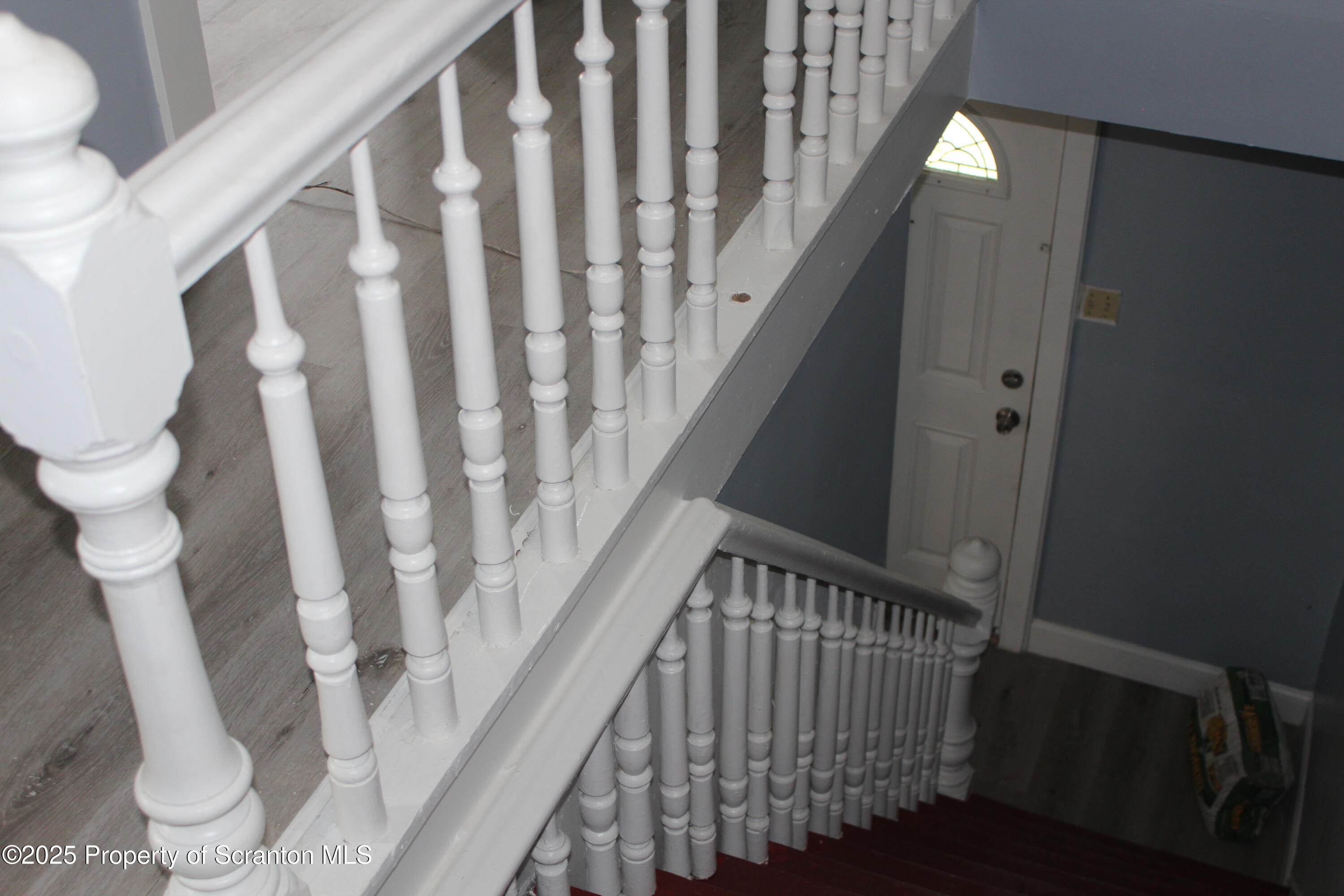1507 Luzerne Street Scranton, PA 18504 - Photo 13 of 26 a view of entryway with stairs and a floor to ceiling window