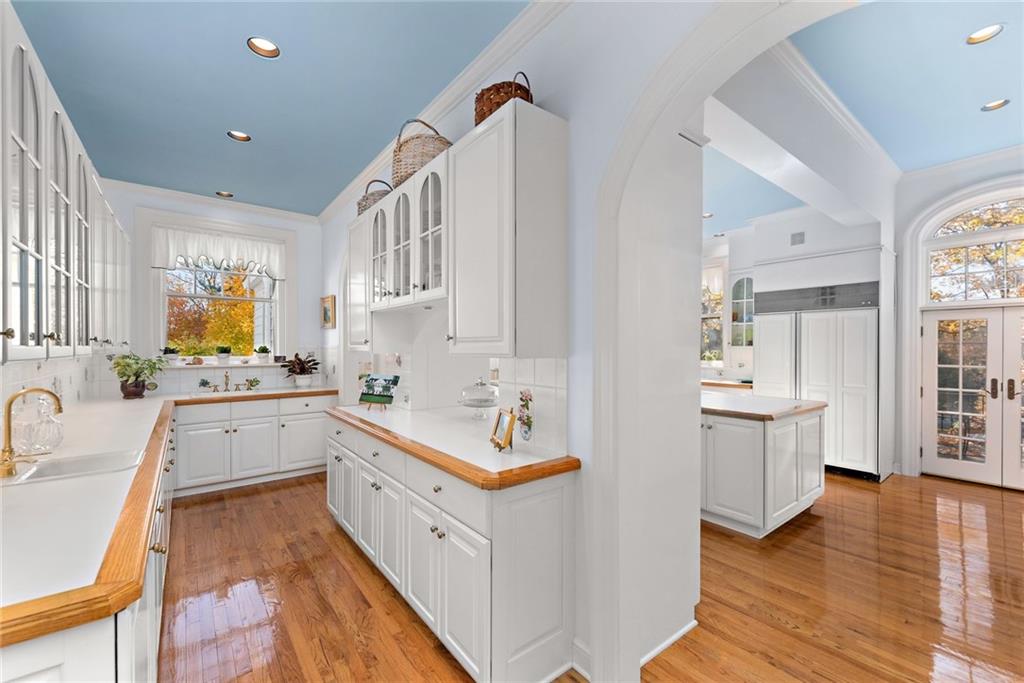 220-2 Scaife Road Sewickley, PA 15143 - Photo 16 of 49 a kitchen with a sink stove and wooden cabinets
