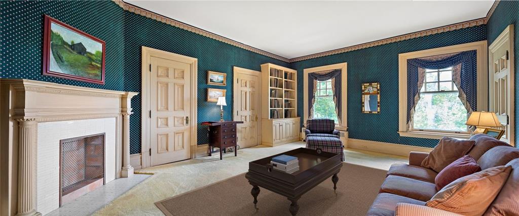 220-2 Scaife Road Sewickley, PA 15143 - Photo 32 of 49 a living room with furniture a fireplace and a large window