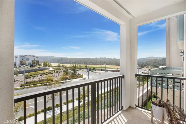 a view of a balcony with city view