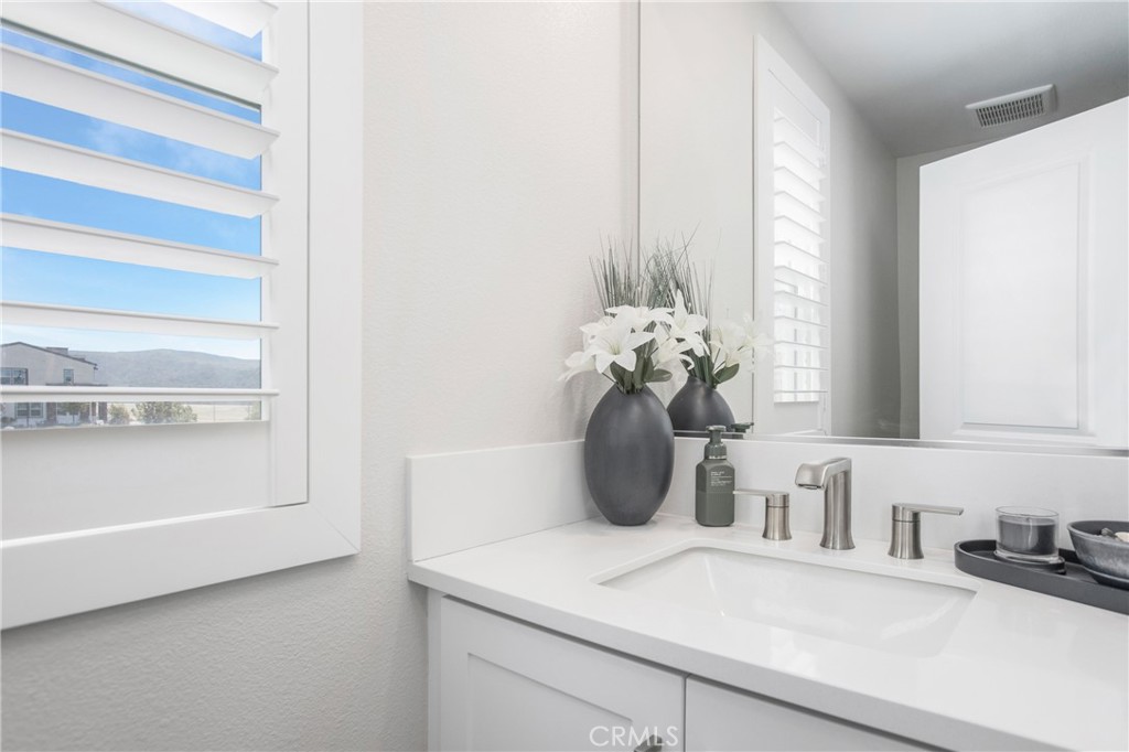 116 Stetson Street Rancho Mission Viejo, CA 92694 - Photo 11 of 45 a bathroom with a sink and a mirror