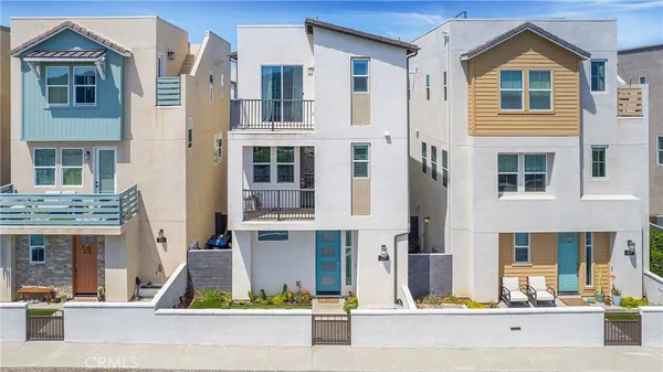 a front view of a residential apartment building with a yard