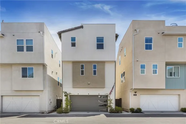 a front view of a house with garage