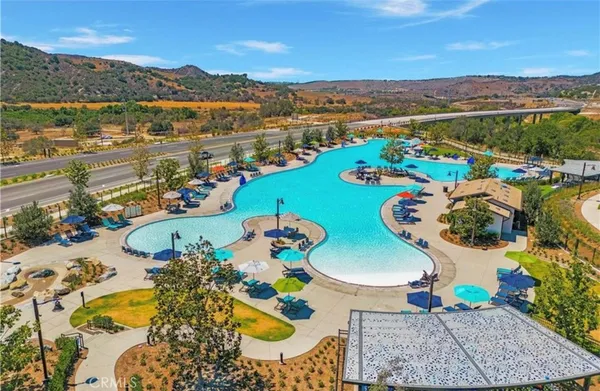 an aerial view of a swimming pool patio and mountain view
