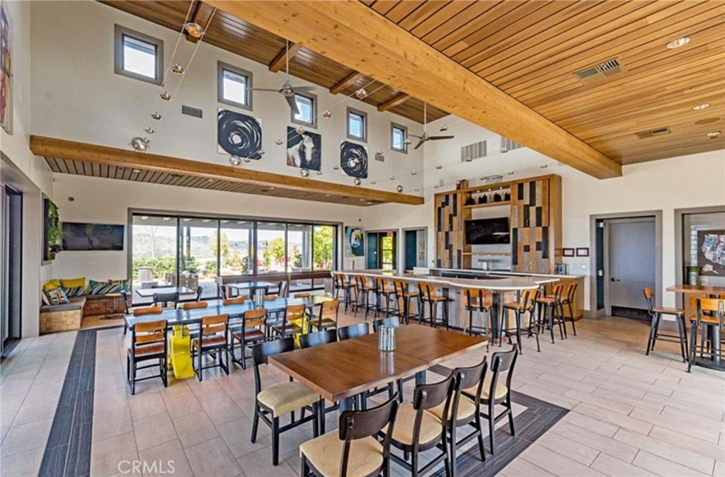 116 Stetson Street Rancho Mission Viejo, CA 92694 - Photo 23 of 45 a dining hall with furniture and a floor to ceiling window
