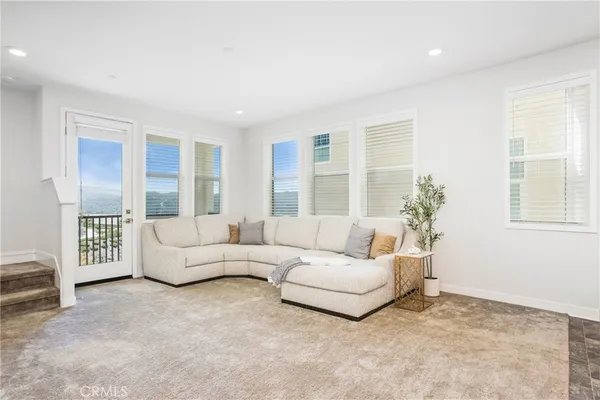a living room with furniture and windows