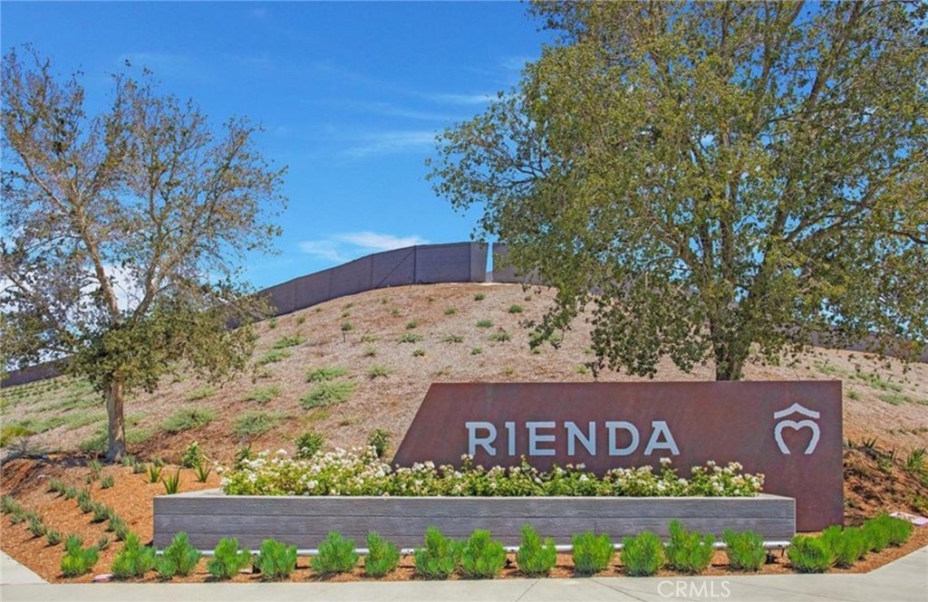 116 Stetson Street Rancho Mission Viejo, CA 92694 - Photo 32 of 45 a view of outdoor space with signage and flags