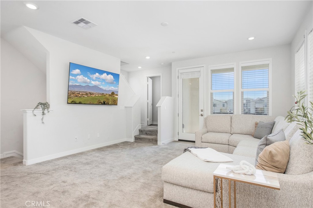116 Stetson Street Rancho Mission Viejo, CA 92694 - Photo 4 of 45 a living room with furniture and a window
