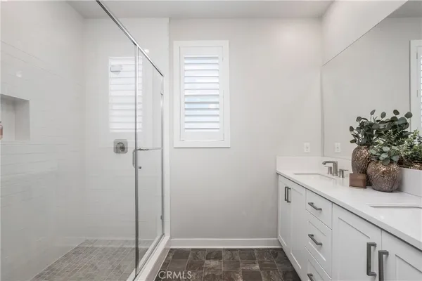 a bathroom with a sink and vanity