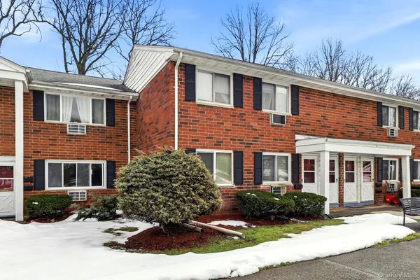 a view of a building with a yard