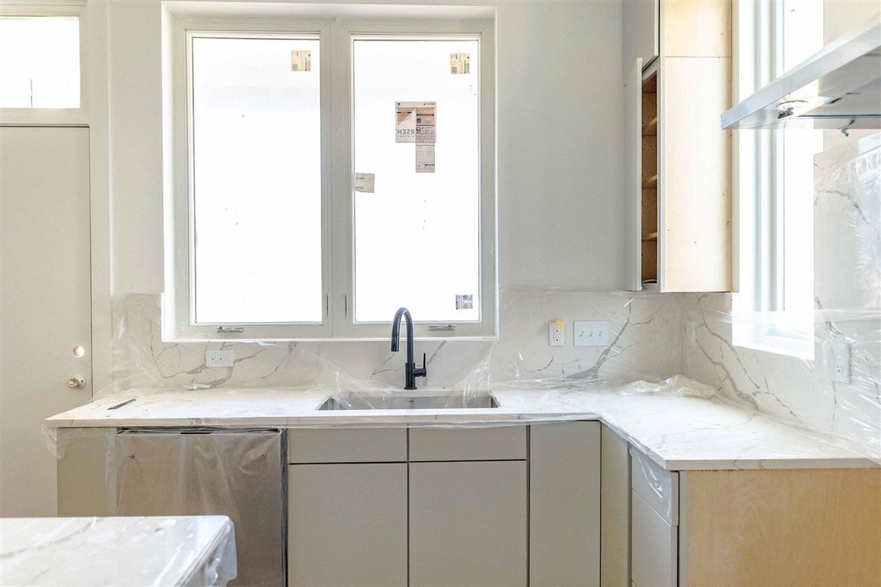 623 North Queen Street Durham, NC 27701 - Photo 12 of 27 a bathroom with a sink and a window