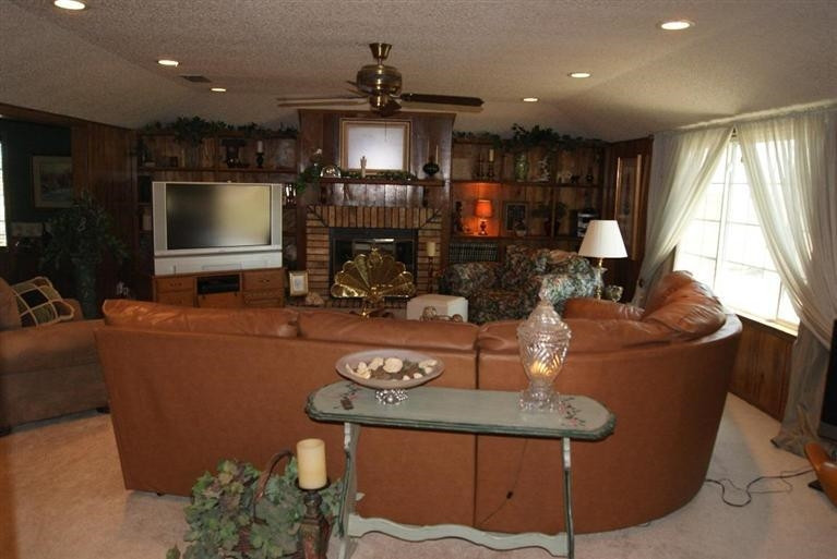 850 Nightingale Road Lubbock, TX 79407 - Photo 6 of 10 a living room with furniture and a flat screen tv