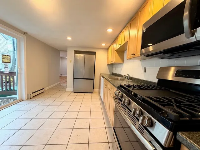 a kitchen with a stove and a microwave