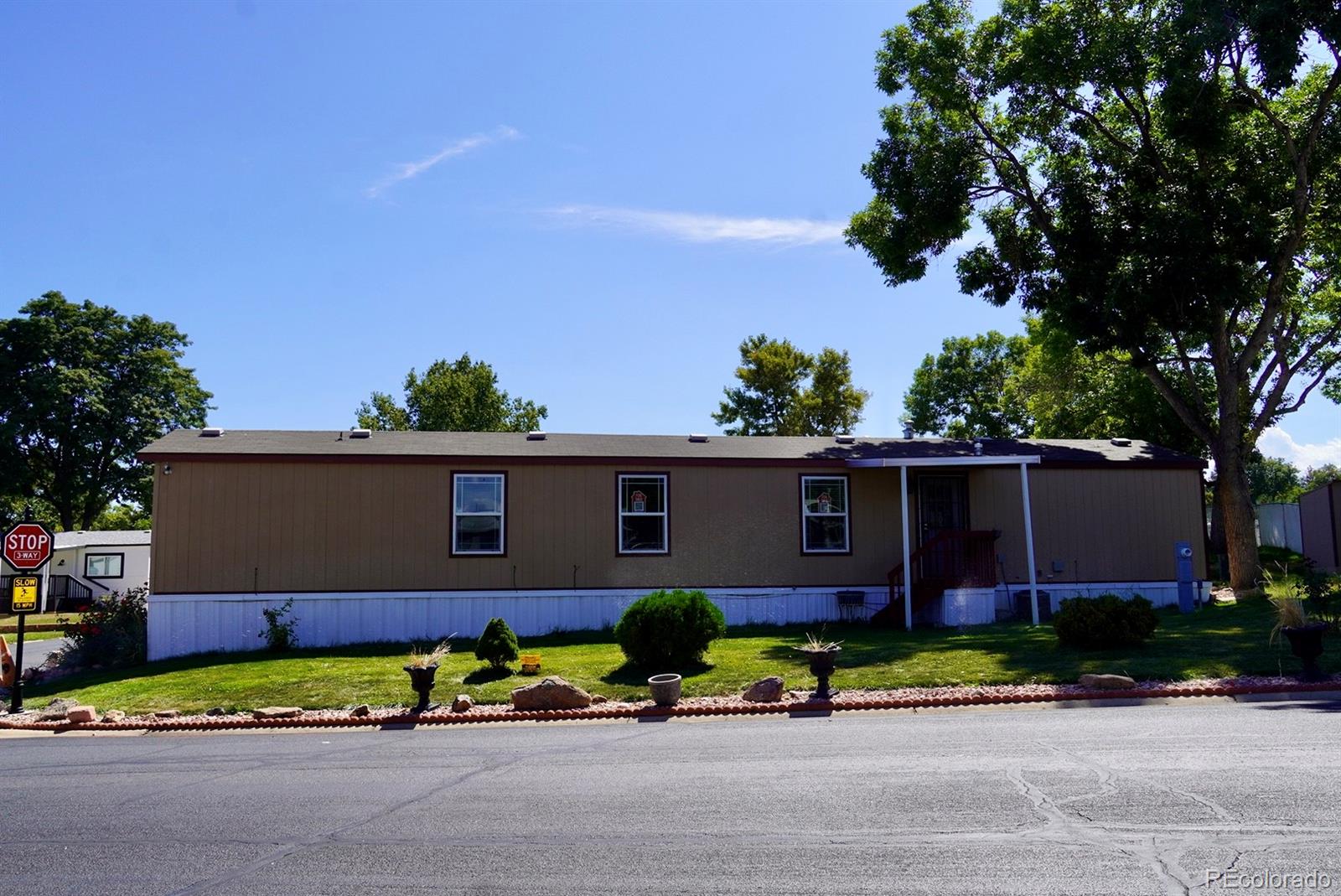 9100 Tejon Street Denver, CO 80260 - Photo 2 of 23 a front view of house with a garden