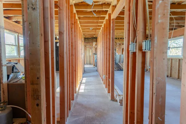 a view of hallway with wooden walls