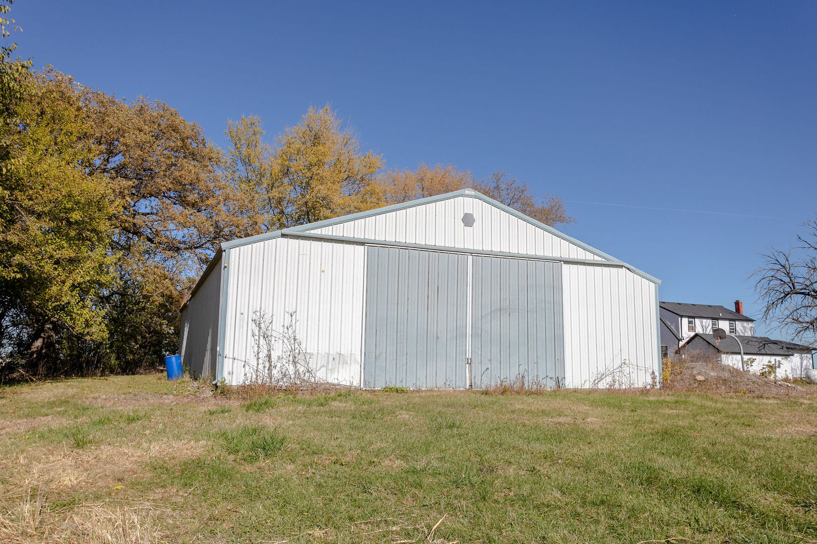 7035 East Scully Road Gardner, IL 60424 - Photo 7 of 25 a view of a backyard with large trees and wooden fence