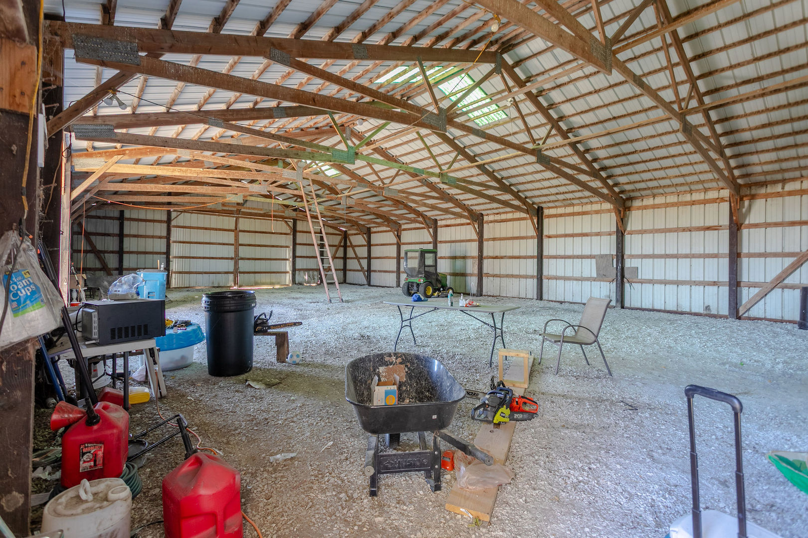 7035 East Scully Road Gardner, IL 60424 - Photo 8 of 25 a backyard of a house with barbeque oven table and chairs