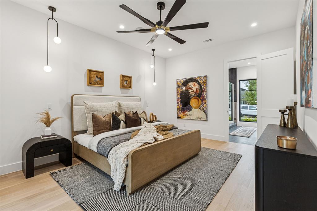 7707 Robin Road Dallas, TX 75209 - Photo 14 of 40 a bedroom with a bed and a couch