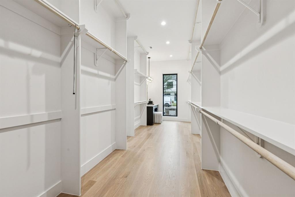 7707 Robin Road Dallas, TX 75209 - Photo 18 of 40 a view of a hallway with wooden floor and staircase