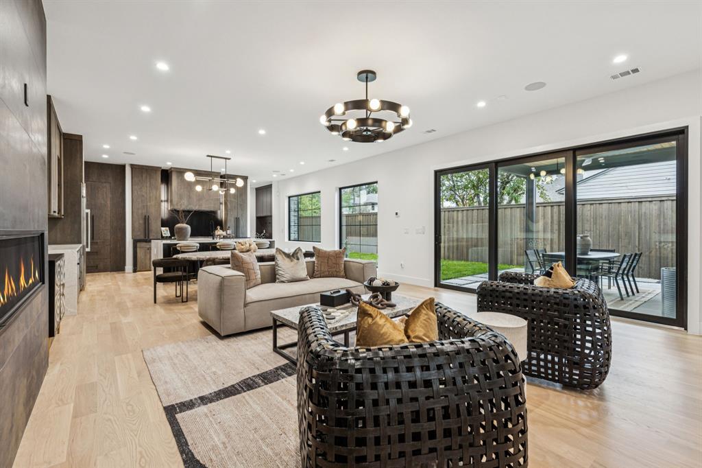 7707 Robin Road Dallas, TX 75209 - Photo 7 of 40 a living room with furniture potted plant and a large window