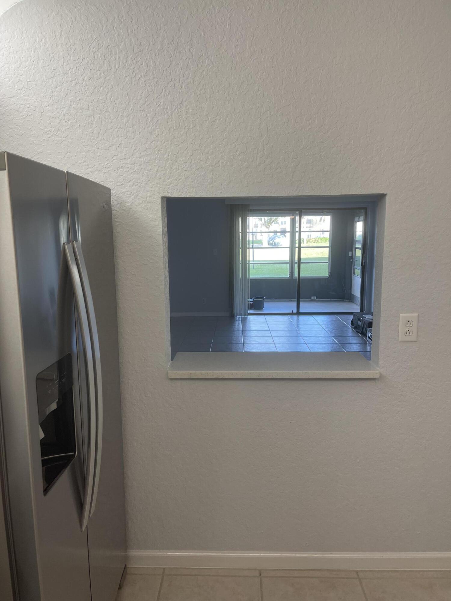 9273 Southwest 8th Street, Unit 116 Boca Raton, FL 33428 - Photo 6 of 15 Kitchen - Living