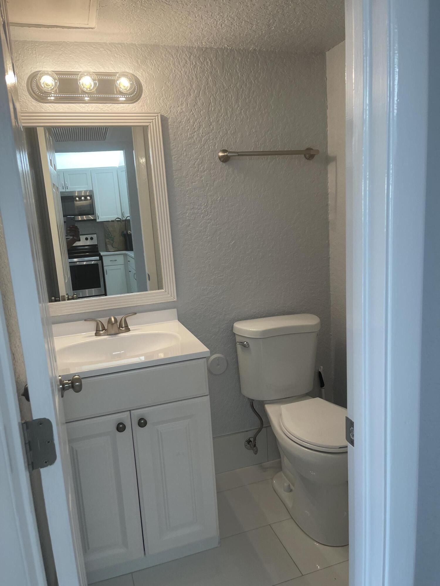 9273 Southwest 8th Street, Unit 116 Boca Raton, FL 33428 - Photo 8 of 15 Half Bathroom