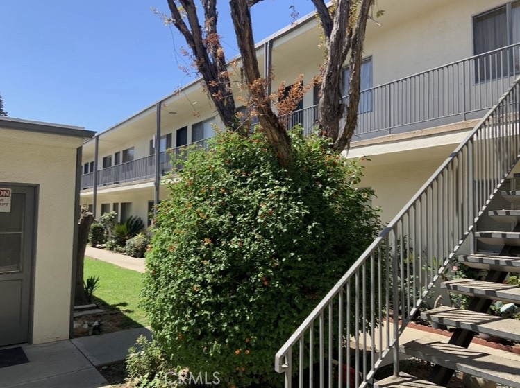 425 Fairview Avenue, Unit 27 Arcadia, CA 91007 - Photo 2 of 6 a view of a house with a small yard and potted plants