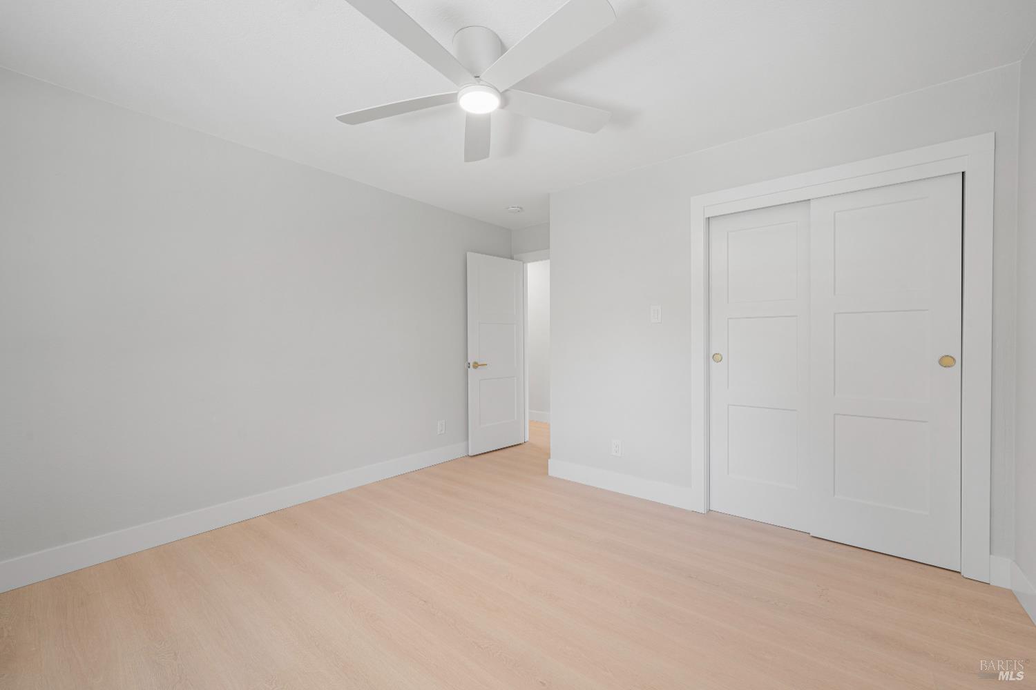 2129 Rockville Road Fairfield, CA 94534 - Photo 30 of 59 an empty room with a ceiling fan and a window